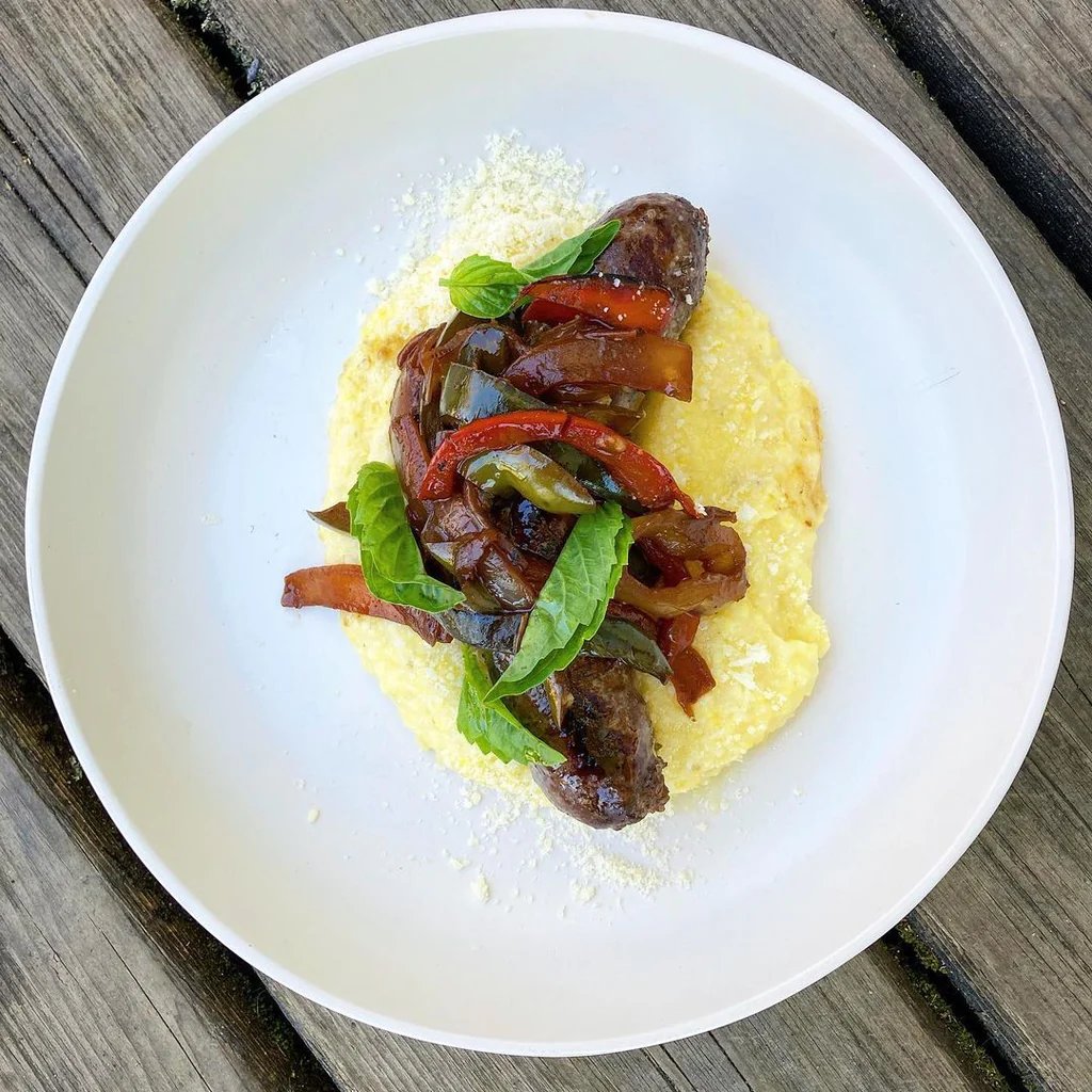 Italian Style Buffalo Sausage Links with Sweet & Sour Peppers and Onions over Ricotta Polenta