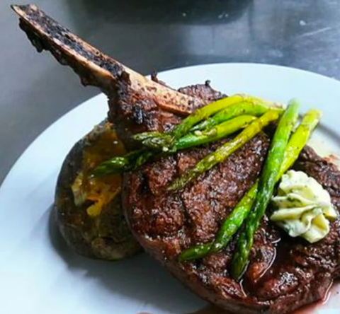 Rib chop with asparagus and rosemary butter