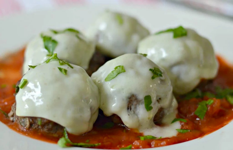 Buffalo Meatballs covered in melted cheese 