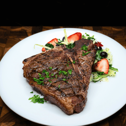 Grilled Bison T-Bone Steak with Caramelized Onions - Jackson Hole Buffalo Meat
