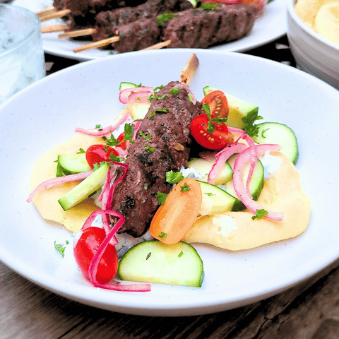 bison kafta with veggies on flatbread