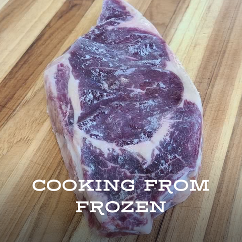 Frozen steak on cutting board